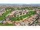 Aerial view of a golf course community with lush green fairways, desert landscaping, and neighborhood homes at 800 W Palo Brea Dr, Litchfield Park, AZ 85340