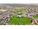 Scenic aerial view showcases green park with lush baseball field, and neighboring residential area at 800 W Palo Brea Dr, Litchfield Park, AZ 85340