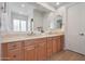 Bathroom featuring a double sink vanity with light countertops and cabinetry at 800 W Palo Brea Dr, Litchfield Park, AZ 85340