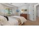 Cozy bedroom with a wooden dresser, light-colored walls, and a window seat at 800 W Palo Brea Dr, Litchfield Park, AZ 85340