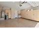 Spacious garage with ample storage cabinets and epoxy flooring perfect for car enthusiasts at 800 W Palo Brea Dr, Litchfield Park, AZ 85340