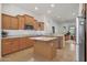 A well-lit kitchen offers ample storage space and stainless steel appliances at 800 W Palo Brea Dr, Litchfield Park, AZ 85340