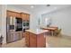 Bright and airy kitchen features stainless steel appliances and a casual dining area at 800 W Palo Brea Dr, Litchfield Park, AZ 85340