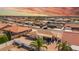 An aerial view of the neighborhood featuring single-story homes with desert landscaping and terracotta-tiled roofs at 8012 E Monte Ave, Mesa, AZ 85209