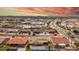 An aerial view of a desert neighborhood showcasing single-Gathering homes with low-maintenance yards and red-tiled roofs at 8012 E Monte Ave, Mesa, AZ 85209