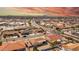 A high-angle neighborhood shot featuring well-maintained homes, desert flora, and distant mountain views at 8012 E Monte Ave, Mesa, AZ 85209