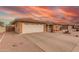 A beautiful single-story home with a spacious two-car garage and well-kept desert landscaping at 8012 E Monte Ave, Mesa, AZ 85209