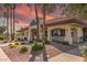 Exterior view of the Golf Shop with desert landscaping and tall palm trees under a stunning colorful sky at 8012 E Monte Ave, Mesa, AZ 85209