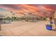 Community tennis court, offering an active lifestyle with well-maintained courts and picturesque sunset views at 8012 E Monte Ave, Mesa, AZ 85209