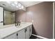 Secondary bathroom with a shower and a neutral countertop with a framed mirror at 8344 N 21St Dr # I105, Phoenix, AZ 85021