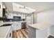 Bright kitchen with white cabinets, stainless steel appliances, and eye-catching backsplash at 8344 N 21St Dr # I105, Phoenix, AZ 85021