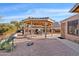 Desert backyard featuring a charming gazebo with seating, perfect for outdoor relaxation and entertainment at 8499 E Jumping Cholla Dr, Gold Canyon, AZ 85118