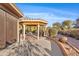 Outdoor patio area with shade, desert views, and desert landscaping at 8499 E Jumping Cholla Dr, Gold Canyon, AZ 85118