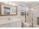 Bathroom featuring walk-in shower, vanity with sink, and ample natural light at 8499 E Jumping Cholla Dr, Gold Canyon, AZ 85118