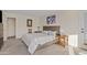 Comfortable bedroom featuring a queen-sized bed, wood nightstands, and carpet at 8499 E Jumping Cholla Dr, Gold Canyon, AZ 85118