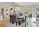 Dining area with a wooden table, gray chairs, and a view into the kitchen at 8499 E Jumping Cholla Dr, Gold Canyon, AZ 85118