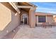 Inviting front entrance with a decorative door and a tiled patio area at 8499 E Jumping Cholla Dr, Gold Canyon, AZ 85118