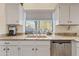 Kitchen sink area featuring a window overlooking the landscape and granite countertops at 8499 E Jumping Cholla Dr, Gold Canyon, AZ 85118