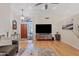 Spacious living room featuring hardwood floors, a ceiling fan, and a cozy atmosphere at 8499 E Jumping Cholla Dr, Gold Canyon, AZ 85118