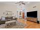 Inviting living room features hardwood floors, ceiling fan, and neutral color palette at 8499 E Jumping Cholla Dr, Gold Canyon, AZ 85118