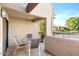 Enjoy outdoor dining on the patio with seating and views of the community tennis courts at 9270 E Mission Ln # 211, Scottsdale, AZ 85258