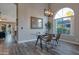 Bright dining room featuring new flooring, dining table, and a large window at 928 S San Joaquin Ct, Gilbert, AZ 85296