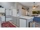 Modern kitchen featuring an island with granite countertops, gray cabinetry, and stainless steel appliances at 928 S San Joaquin Ct, Gilbert, AZ 85296