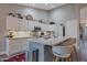 Bright kitchen with stainless steel appliances, granite counters, and island seating at 928 S San Joaquin Ct, Gilbert, AZ 85296