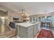 Open-concept kitchen featuring an island with seating that connects seamlessly with the living area at 928 S San Joaquin Ct, Gilbert, AZ 85296