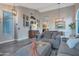 Inviting living room with vaulted ceiling, plenty of natural light, and views into dining room at 928 S San Joaquin Ct, Gilbert, AZ 85296