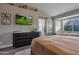 Serene main bedroom with a sliding barn door to the bathroom and a large window at 928 S San Joaquin Ct, Gilbert, AZ 85296