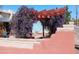 Outdoor view of a pergola featuring climbing plants over a paver patio at 94 W 12Th St, Florence, AZ 85132