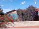 A charming backyard view of a pergola next to a painted storage shed at 94 W 12Th St, Florence, AZ 85132