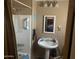 Cozy bathroom with a shower, sink, mirror and neutral colored walls at 94 W 12Th St, Florence, AZ 85132