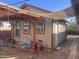 Tan colored guest house with a pergola and patio seating at 94 W 12Th St, Florence, AZ 85132