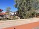 Exterior view of house, trees, and pedestrian walkway at 94 W 12Th St, Florence, AZ 85132