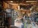 Cluttered garage with door, calendar, shelving and work bench at 94 W 12Th St, Florence, AZ 85132