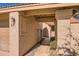 Charming covered entrance way with tile and stucco walls leading to the front door at 945 N Pasadena -- # 52, Mesa, AZ 85201