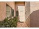 Inviting front entrance with decorative tile pathway, a cozy mat and lush greenery at 945 N Pasadena -- # 52, Mesa, AZ 85201