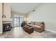 Comfortable living room with a fireplace, neutral tones, tile floors, and natural light at 945 N Pasadena -- # 52, Mesa, AZ 85201