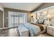 Tranquil main bedroom featuring a plush bed, custom built-ins, and bright shuttered windows at 945 N Pasadena -- # 52, Mesa, AZ 85201