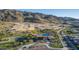 Aerial view of a community pool with mountain views and landscaping at 9814 S 11Th St, Phoenix, AZ 85042