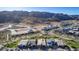 Aerial view of newly constructed homes in a community with mountain views and open space at 9814 S 11Th St, Phoenix, AZ 85042