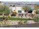 Home exterior showcasing landscaped grounds, a covered patio, and scenic neighborhood views at 9814 S 11Th St, Phoenix, AZ 85042