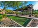 Community amenities include a Bocce ball court, seating area, and covered picnic tables at 9814 S 11Th St, Phoenix, AZ 85042