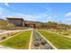 Exterior view of modern building with desert landscaping and mountain views at 9814 S 11Th St, Phoenix, AZ 85042