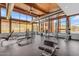 Well-equipped gym features fitness machines, rubber floor, high ceilings, and a scenic desert view at 9814 S 11Th St, Phoenix, AZ 85042