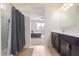 Well-lit bathroom featuring a walk-in shower, a vanity, and a view to the bedroom area at 1021 W Descanso Canyon Dr, Casa Grande, AZ 85122