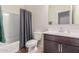 Cozy bathroom featuring a shower-tub combo and vanity with a sink at 1021 W Descanso Canyon Dr, Casa Grande, AZ 85122