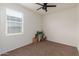 Neutral bedroom with ceiling fan, natural light and carpeted floor at 1021 W Descanso Canyon Dr, Casa Grande, AZ 85122